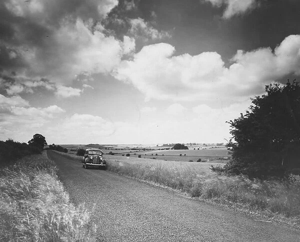Fosse Way. A car on the ancient Fosse Way in the Cotswolds