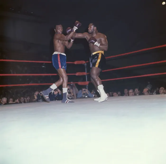 Framed Print : Foster Tries to Block a Frazier Left Hook Framed Print : Foster Tries to Block a Frazier Left Hook