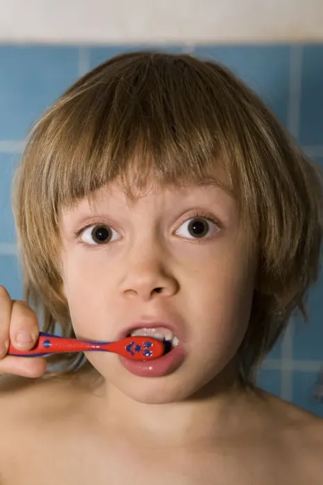 Framed Print : Four-year-old blond boy brushing his teeth Framed Print : Four-year-old blond boy brushing his teeth