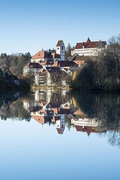 The former Franciscan Monastery of St. Mang, reflection in the Lech river, Fuessen, Ostallgaeu region, Allgaeu, Bavaria, Germany, Europe
