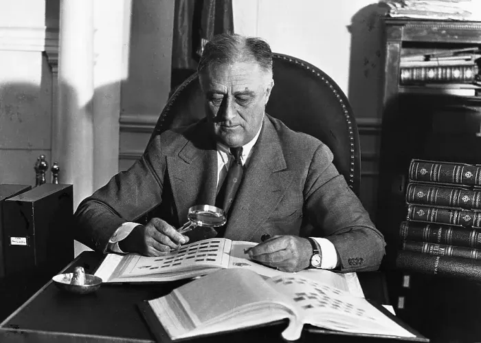 Framed Print : Franklin Delano Roosevelt Looking at His Stamp Collection Framed Print : Franklin Delano Roosevelt Looking at His Stamp Collection