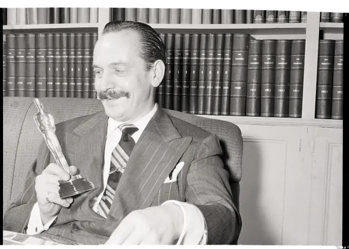 Framed Print : Frederick March Holds Cardboard Oscar