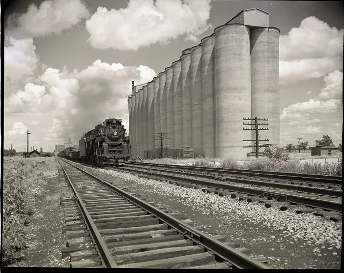 Framed Print : Freight Train Passing Grain Elevators Framed Print : Freight Train Passing Grain Elevators