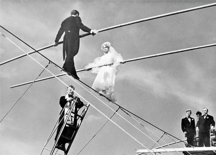 Framed Print : French Bride and Groom on a High Wire with Attending Priest Framed Print : French Bride and Groom on a High Wire with Attending Priest