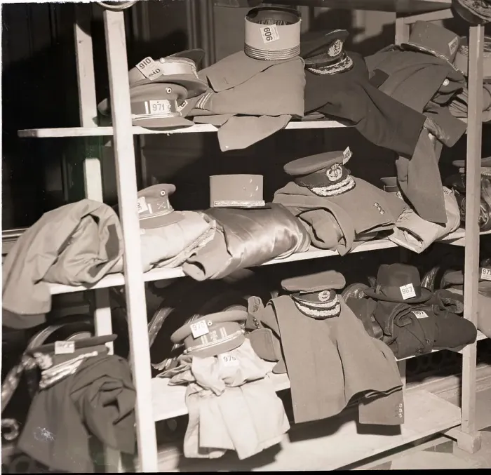 Framed Print : French Military Uniforms on Shelves