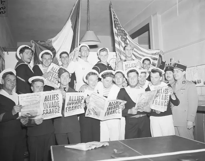 Framed Print : French Servicemen Read About D-Day