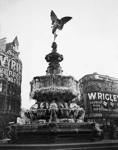 Frosty Eros; The Eros statue at Piccadilly Circus covered in icicles during a cold snap