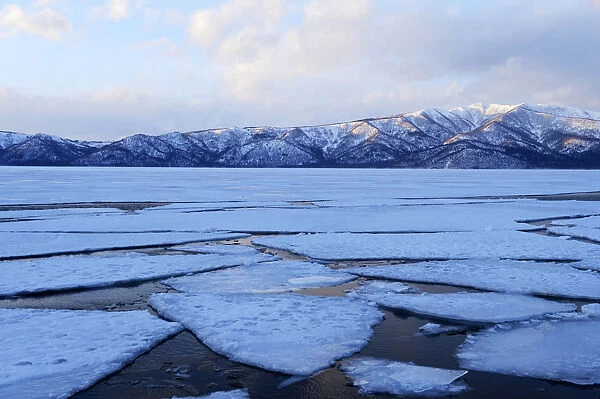 Frozen Lake Kussharo with ice floes in the front, Akan-Nationalpark, Kawayu Onsen, Hokkaido, Japan