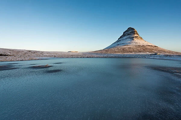 The frozen lake and Mt. Kirkjufell, Iceland