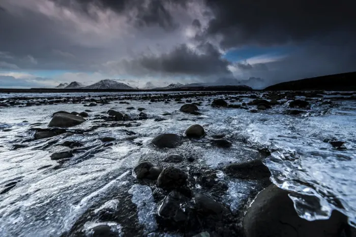 Framed Print : Frozen Seljalandsa river with dramatic cloudy sky, Vik, Iceland Framed Print : Frozen Seljalandsa river with dramatic cloudy sky, Vik, Iceland