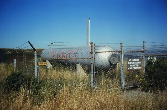 Framed Print : Fuel Tank Behind Fence Framed Print : Fuel Tank Behind Fence