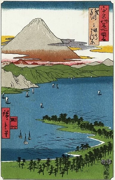 Fuji-San. A view of Mount Fuji across a lake with white sailed boats, early 1900s
