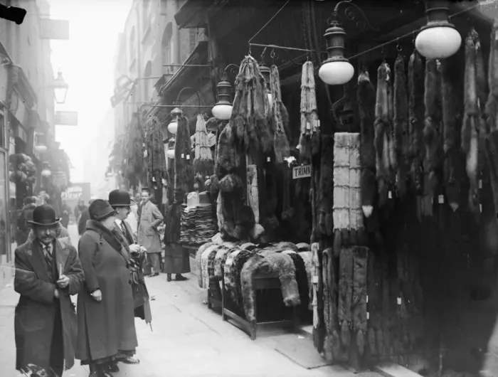 Framed Print : Fur Store. April 1929: Fur coats and accessories hang outside a fur stall Framed Print : Fur Store. April 1929: Fur coats and accessories hang outside a fur stall