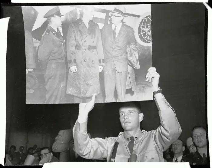 Framed Print : G. David Schine Holding up Large Picture Poster in Court