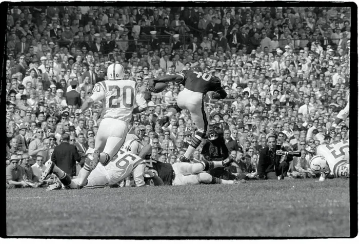 Framed Print : Gale Sayers Leaps Over Downed Players Framed Print : Gale Sayers Leaps Over Downed Players