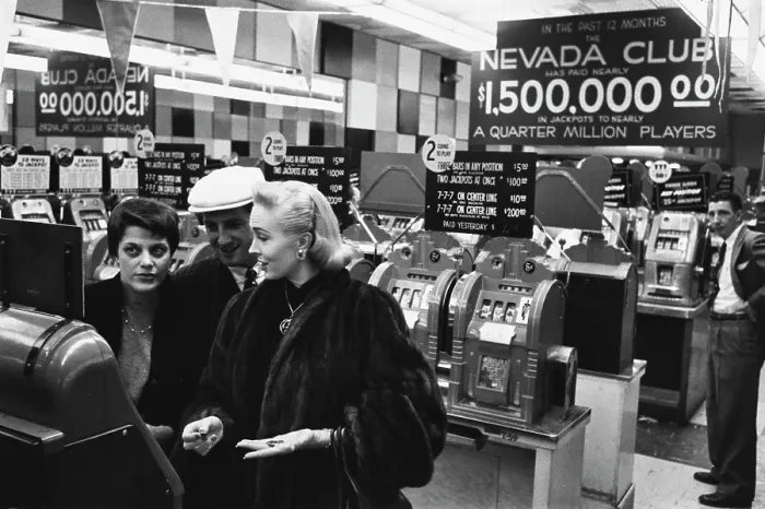 Framed Print : Gamblers Hit The Slots In Las Vegas