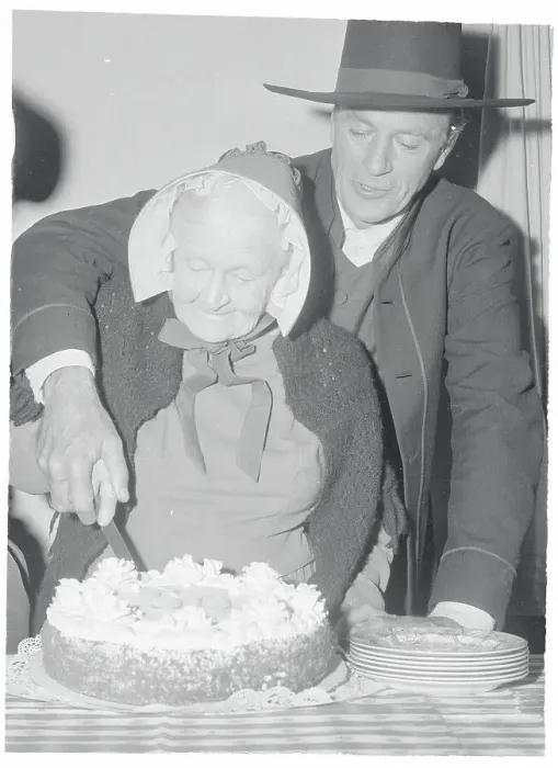 Framed Print : Gary Cooper Helping Mary Carr Cut a Cake Framed Print : Gary Cooper Helping Mary Carr Cut a Cake