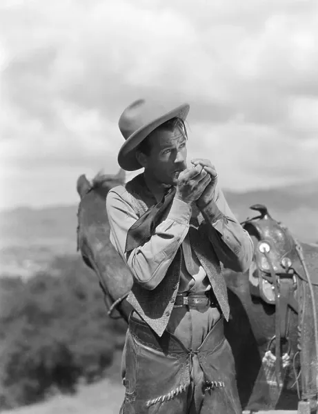 Gary Cooper Lighting Cigarette Print: Western Film Hero. Art
