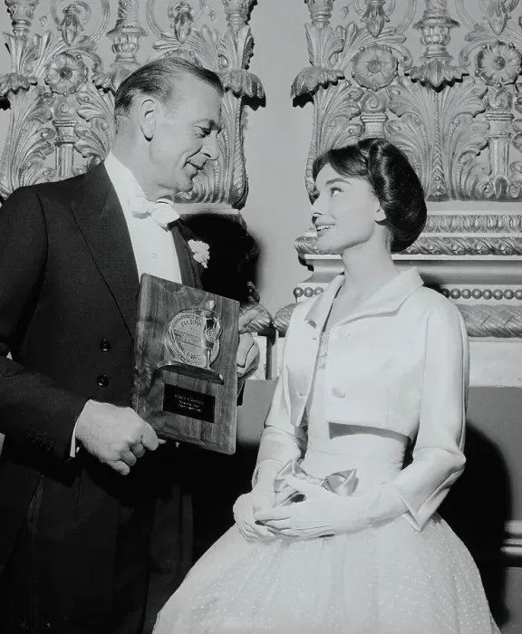 Framed Print : Gary Cooper Showing His Award to Audrey Hepburn Framed Print : Gary Cooper Showing His Award to Audrey Hepburn