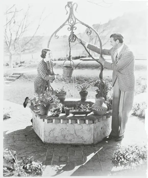 Framed Print : Gary Cooper and Wife at Wishing Well Framed Print : Gary Cooper and Wife at Wishing Well