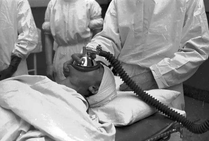 Framed Print : Gas Man. 1st October 1938: An anaesthetist applying a mask to a patient's