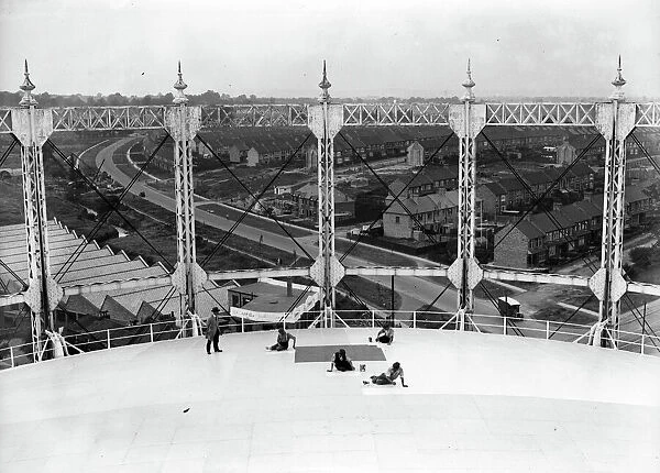 Gas Tank. Workers paint a gasometer at New Southgate in North London