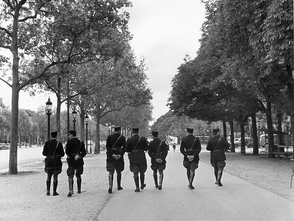 Gendarmes. French policemen patrolling the Champs-Elysees in Paris