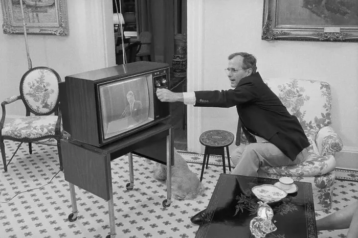 Framed Print : George Bush Adjusting a Television Framed Print : George Bush Adjusting a Television