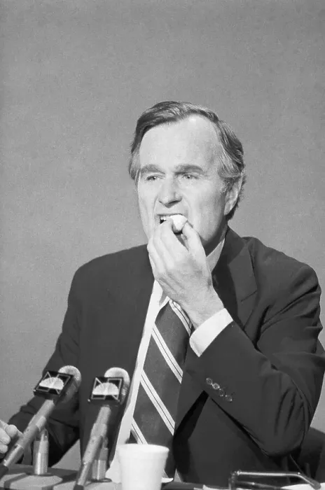 Framed Print : George Bush Eating a Doughnut Framed Print : George Bush Eating a Doughnut