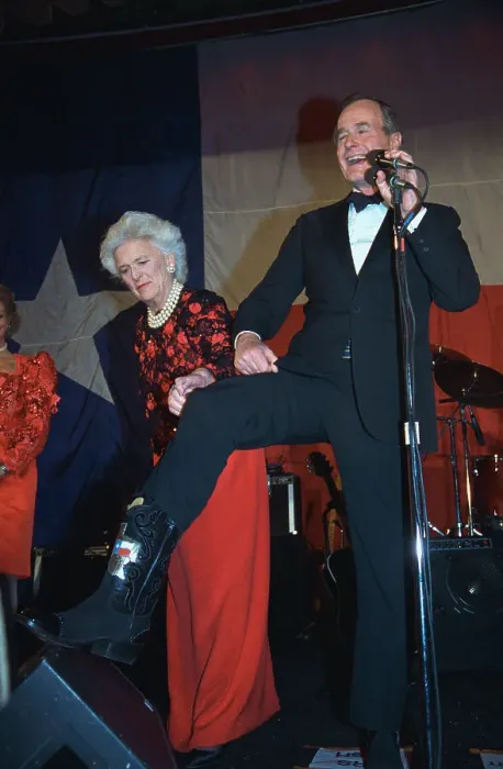 Framed Print : George Bush and Wife Showing Off Cowboy Boots