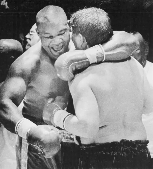 Framed Print : George Foreman Hugging Opponent