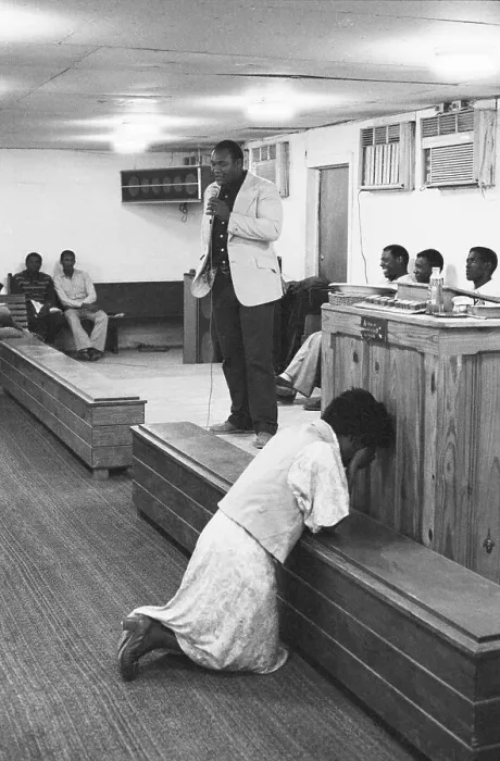 Framed Print : George Foreman Preaches, Woman Prays