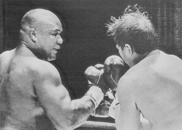 Framed Print : George Foreman Punching Opponent Framed Print : George Foreman Punching Opponent