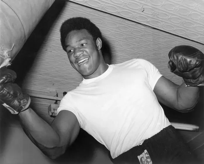 Framed Print : George Foreman Strikes Punching Bag Framed Print : George Foreman Strikes Punching Bag