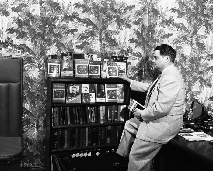 Framed Print : George Wilson Looks at Billy Graham's Book Framed Print : George Wilson Looks at Billy Graham's Book