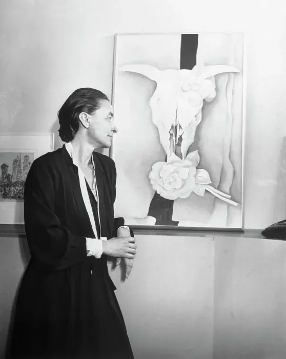 Framed Print : Georgia O'Keeffe Looking at Her Painting of Bleached Bones and Flowers