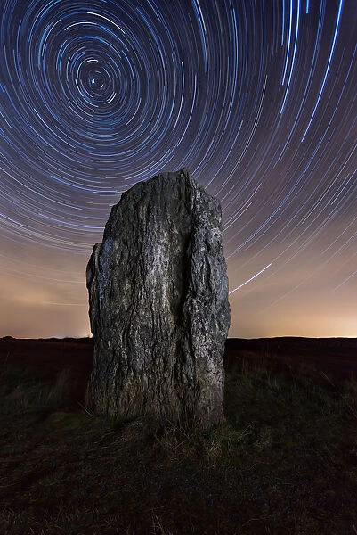 Germany, menhir and star trails