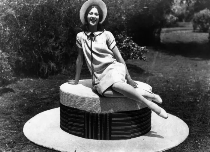 Framed Print : Giant Hat. 1927: A woman sitting on the worlds biggest straw hat Framed Print : Giant Hat. 1927: A woman sitting on the worlds biggest straw hat