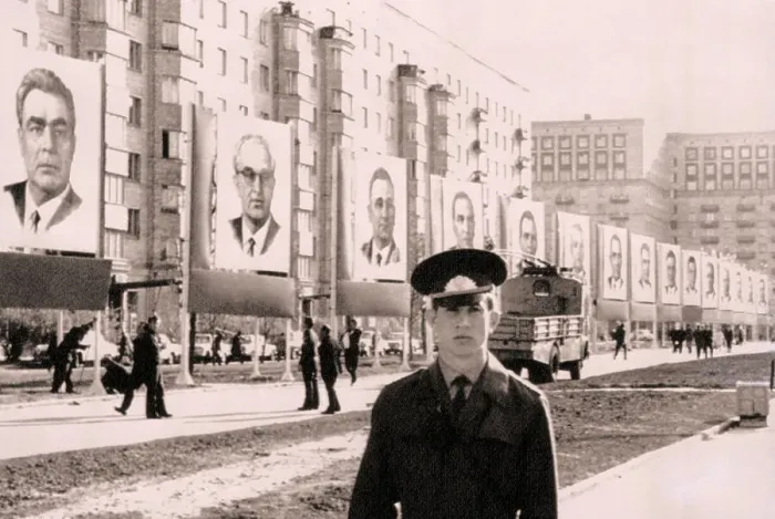 Framed Print : Giant Portraits Hanging from Buildings Framed Print : Giant Portraits Hanging from Buildings