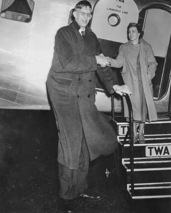 Framed Print : Giant Robert Wadlow Escorting Stewardess off of Airplane Framed Print : Giant Robert Wadlow Escorting Stewardess off of Airplane