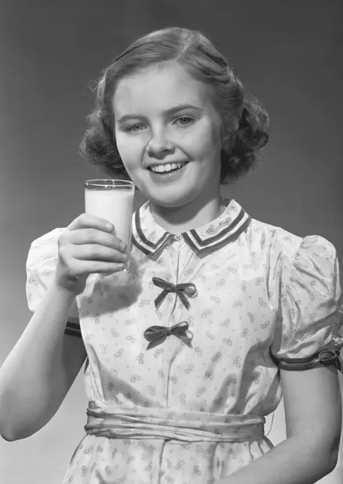 Framed Print : Girl (12-13) posing with glass of milk, (B&W), portrait Framed Print : Girl (12-13) posing with glass of milk, (B&W), portrait