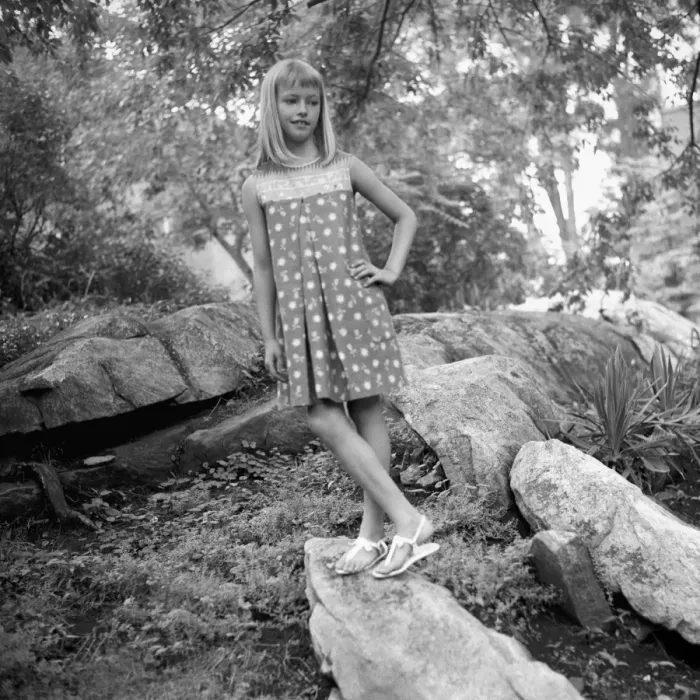Framed Print : Girl (12-13) standing on boulder in forest, (B&W) Framed Print : Girl (12-13) standing on boulder in forest, (B&W)