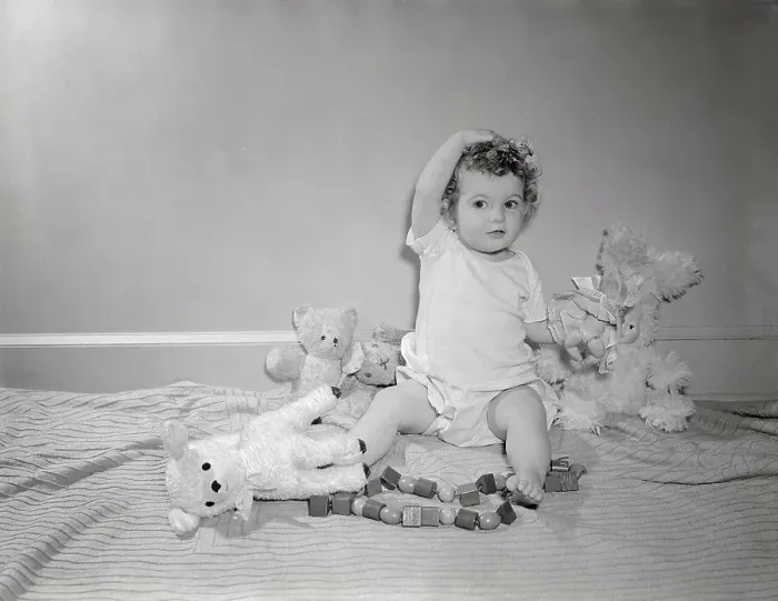 Framed Print : Girl (2-3) playing with toys