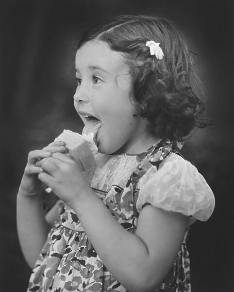 Girl (3-4) eating ice cream (B&W)