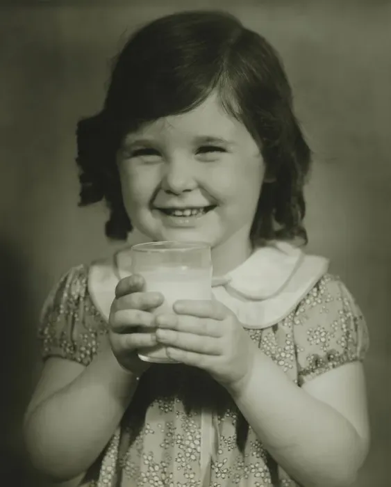 Framed Print : Girl (4-5) holding glass of milk, (B&W), portrait Framed Print : Girl (4-5) holding glass of milk, (B&W), portrait
