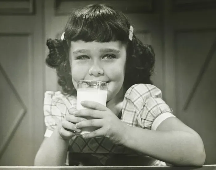 Framed Print : Girl (6-7) sitting at table, drinking milk, (B&W), (Close-up), (Portrait) Framed Print : Girl (6-7) sitting at table, drinking milk, (B&W), (Close-up), (Portrait)