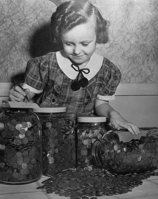 Framed Print : Girl (6-7 years) with jars full of saved money. Cleveland, Ohio, USA. April 27, 1938 Framed Print : Girl (6-7 years) with jars full of saved money. Cleveland, Ohio, USA. April 27, 1938