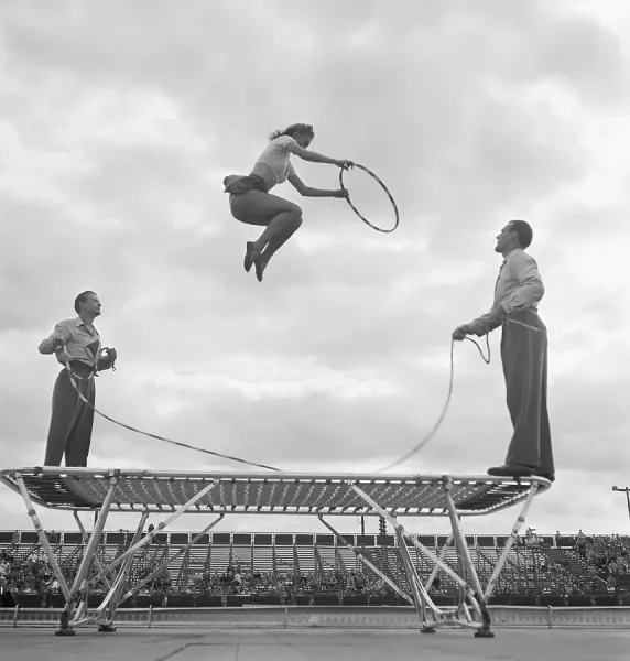 Girl Bouncing Through Hoop on Trampoline Print. Art Prints