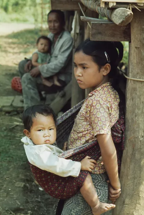Framed Print : A Girl Carrying Her Baby Brother Framed Print : A Girl Carrying Her Baby Brother