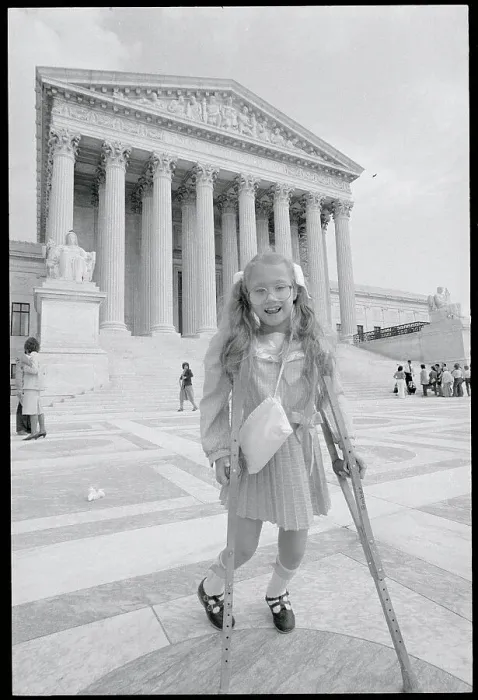 Framed Print : Girl on Crutches Outside of Supreme Court Framed Print : Girl on Crutches Outside of Supreme Court